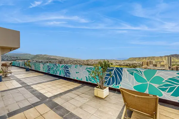 Rooftop pool deck with colorful tropical mural accents