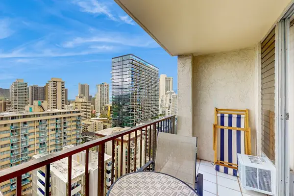 Balcony seating with vibrant Waikiki skyline views