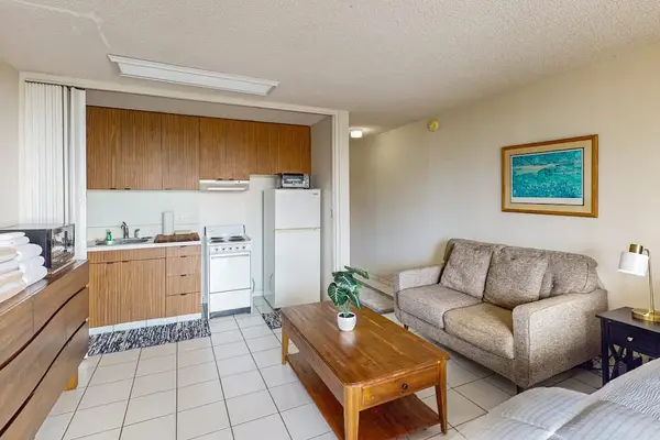Open studio layout combines a full kitchen and comfortable seating
