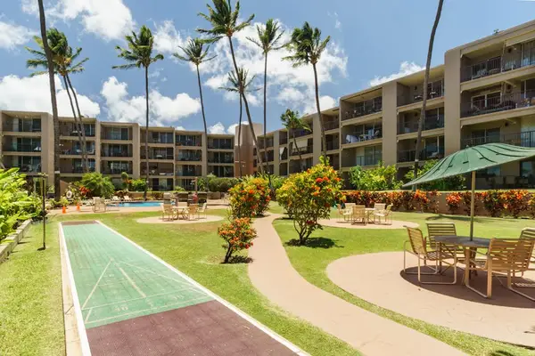 Outdoor dining area and shuffleboard court.