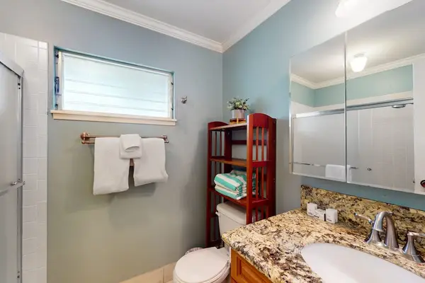Soak and unwind in the full bathroom featuring a relaxing bathtub daily