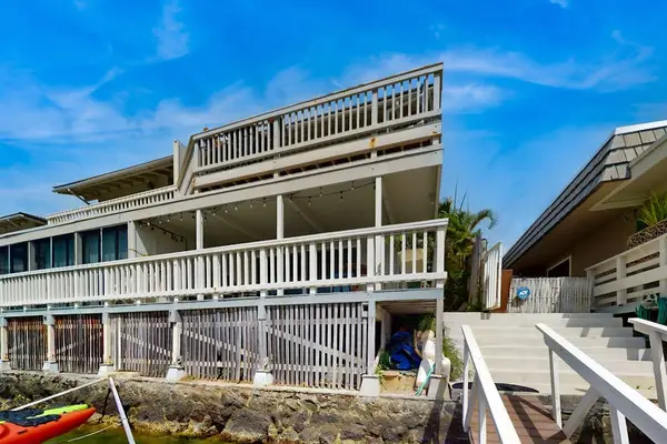 Rear view showcases the home's welcoming outdoor charm and peaceful surroundings beautifully