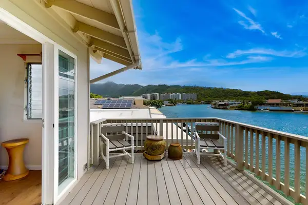 Upstairs master bedroom opens directly onto a peaceful balcony for relaxing mornings