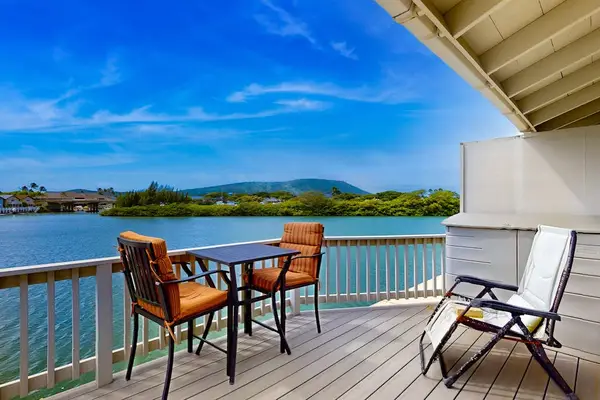 Soak in peaceful waterfront scenery from the charming Kuapa Isle balcony daily