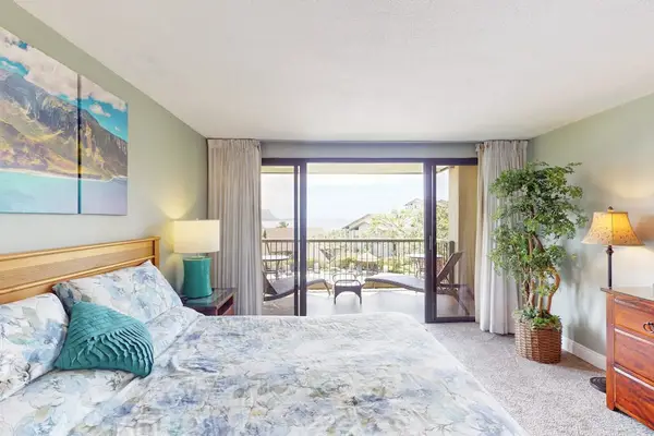 Captures mountain views beyond bright island inspired linens