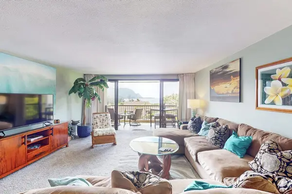 Bright lounge blends island decor comfortable seating and balcony views