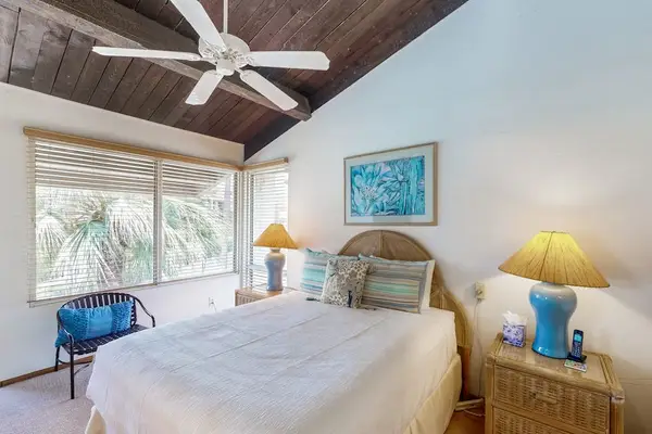 Comfortable Second Bedroom With Vaulted Ceilings