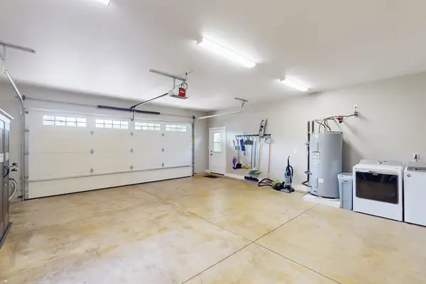 Spacious Garage With Convenient Parking and Laundry Area