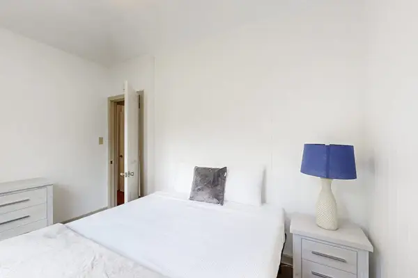 Relax and recharge in a comfortable bedroom featuring a queen-size bed for a restful stay.