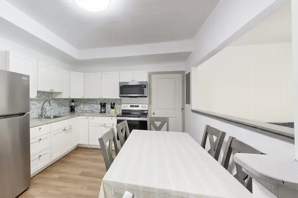 A welcoming space where guests can enjoy meals, conversations, and the convenience of a connected kitchen.