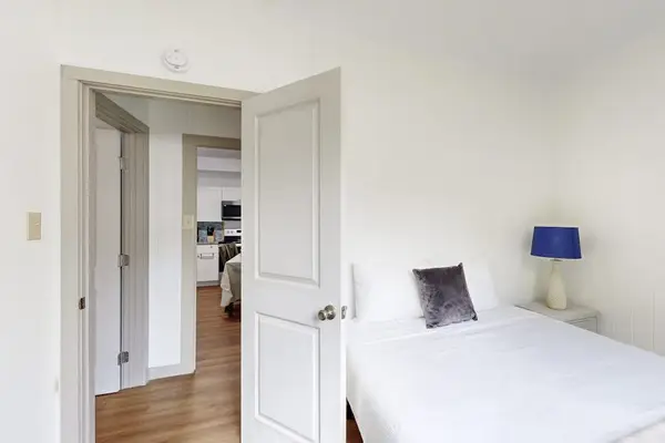 Enjoy a peaceful night’s sleep in a cozy bedroom with a comfortable queen-size bed.