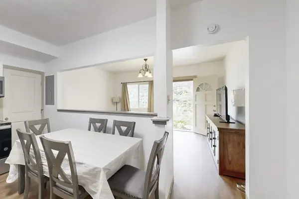Gather around the table and enjoy meals together in a warm and inviting dining space.