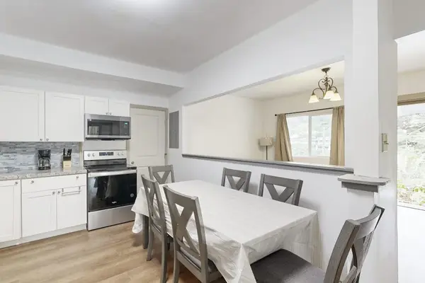 Enjoy shared meals and easy conversation in a welcoming dining area that flows seamlessly into the kitchen.