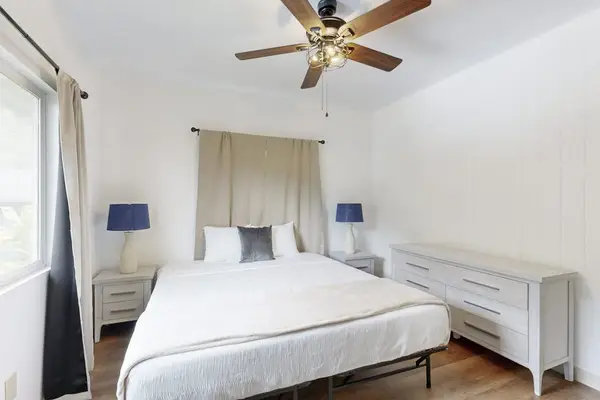 Rest comfortably in a welcoming bedroom featuring a spacious king-size bed.