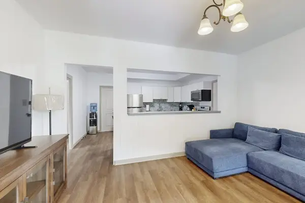 Relax and unwind in a comfortable living room featuring a TV and ceiling fan for your enjoyment.