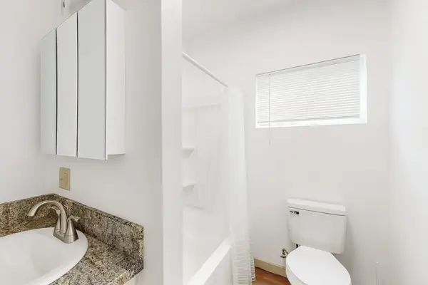 Refresh and unwind in a comfortable bathroom featuring both a bathtub and shower.