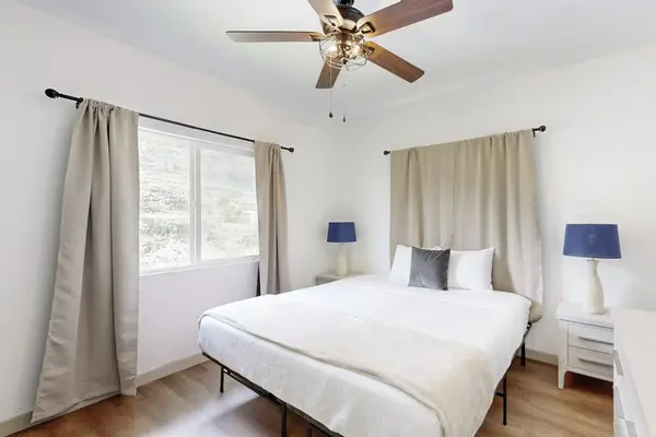 Unwind in a spacious bedroom featuring a king-size bed for a restful night's sleep.