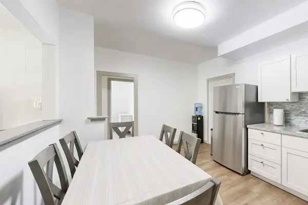 Gather around the dining table and prepare your favorite meals in this open and functional space.