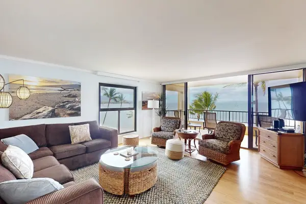Bright living room with comfortable seating and sofa bed