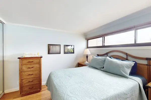 Relax in a cozy queen bedroom after a day of exploring