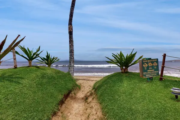Oceanfront lawn with direct beach access