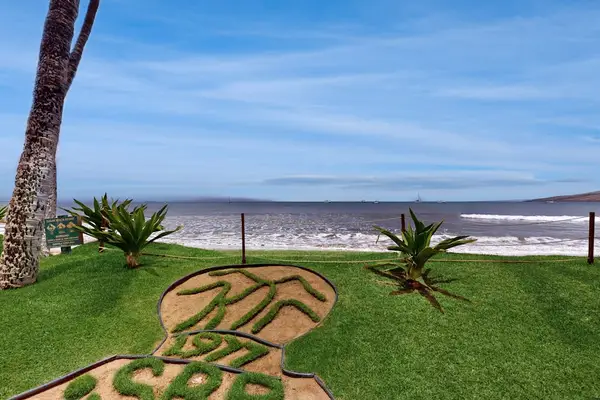 Relax on the oceanfront lawn with stunning coastal views