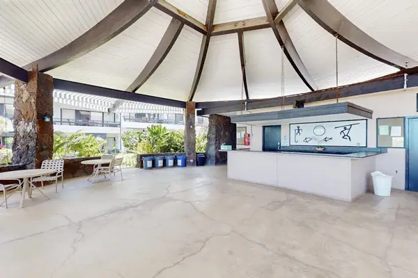 Charming gazebo offers shaded seating for relaxed outdoor island gatherings