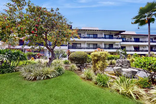 Charming stone exterior welcomes guests with grounds and island views