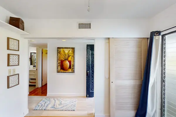 Bedroom Entrance View with Built-In Closets & Private Bath Access