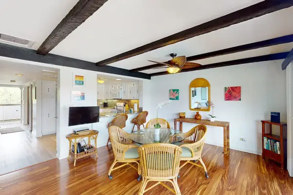 Dining Area View Showing Kitchen Bar & Vaulted Beamed Ceilings