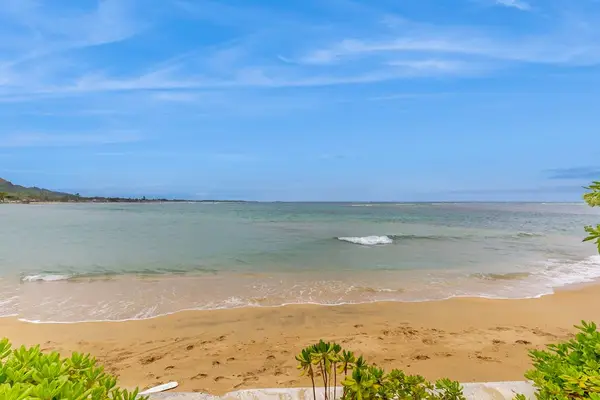 Sandy beach just steps from the backyard