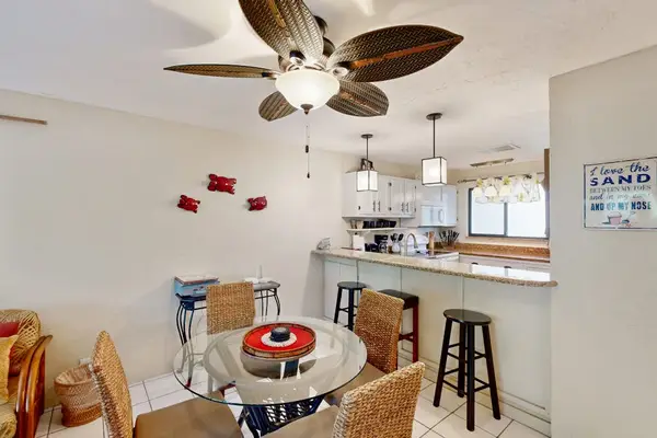 Small dinning area with rattan furniture and tropical ceiling fan