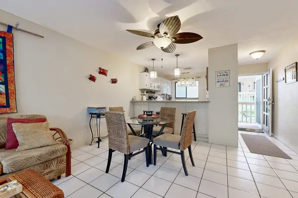 Small dinning area with rattan furniture and tropical ceiling fan