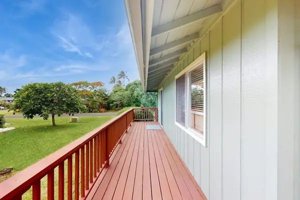 Step outside to the wraparound lanai, where lush tropical foliage creates a peaceful backdrop for morning coffee or evening conversation.