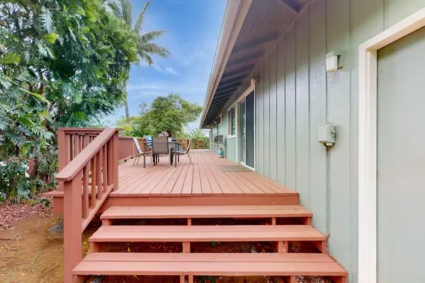 Step outside to the wraparound lanai, where lush tropical foliage creates a peaceful backdrop for morning coffee or evening conversation.