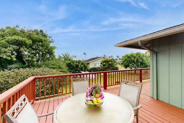 Step outside to the wraparound lanai, where lush tropical foliage creates a peaceful backdrop for morning coffee or evening conversation.
