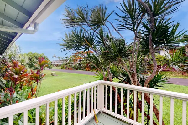 Lush tropical foliage surrounds this lovely home.