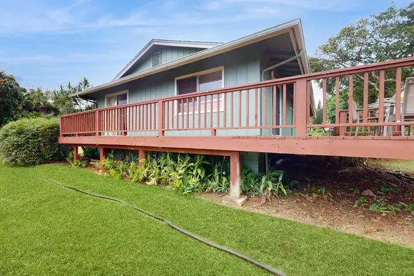 Step outside to the wraparound lanai, where lush tropical foliage creates a peaceful backdrop for morning coffee or evening conversation.
