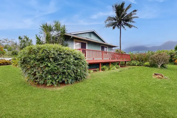 Enjoy this lovely home and private yard with the tropical foliage.