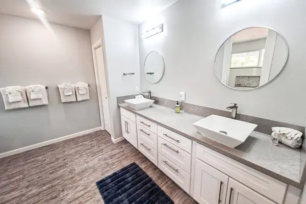 Master en-suite bathroom with double sinks and walk in shower.