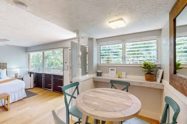 Covered dining space with tropical views