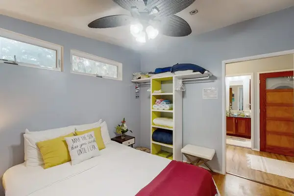 Guest bedroom with convenient shelving for your belongings