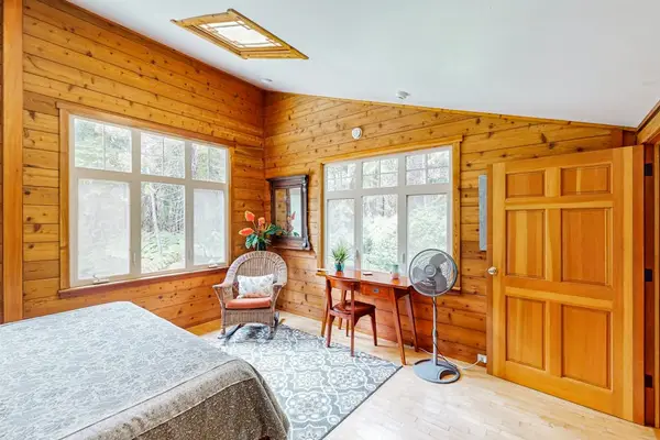Spacious bedroom with a comfortable seating area