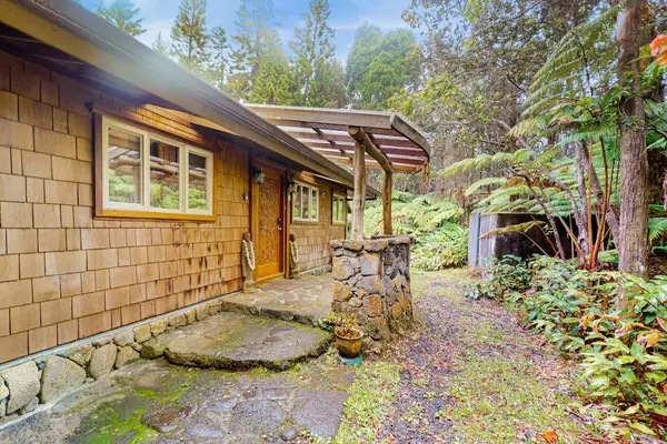 Welcoming entrance surrounded by lush greenery