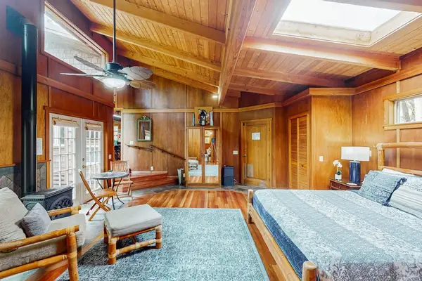Spacious bedroom with a cozy seating area