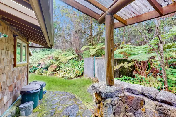 Covered outdoor entry surrounded by nature