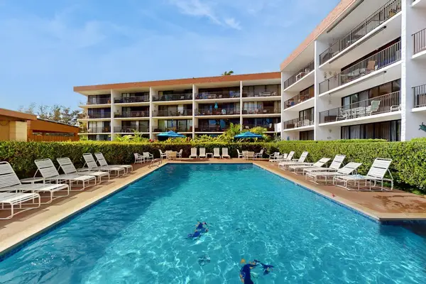 Sparkling Resort Pool Deck & Sun Loungers