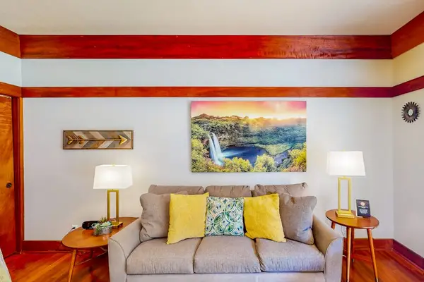 Living room with a comfortable sofa bed for any extra company and a flat screen tv.