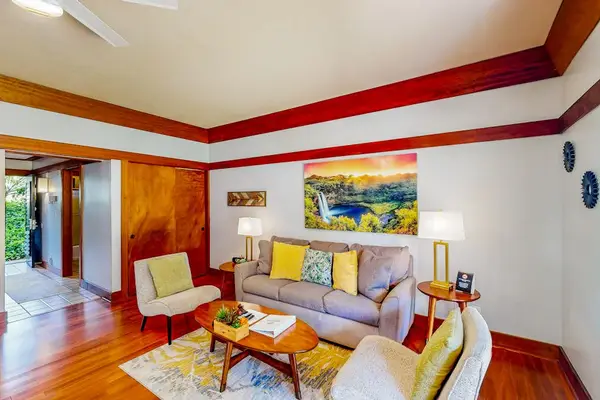 Living room with a comfortable sofa bed for any extra company and a flat screen tv.f