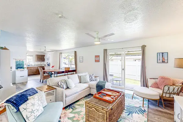 Living room with plenty of seating for relaxing on the sofa bed or a table for having a game night.
